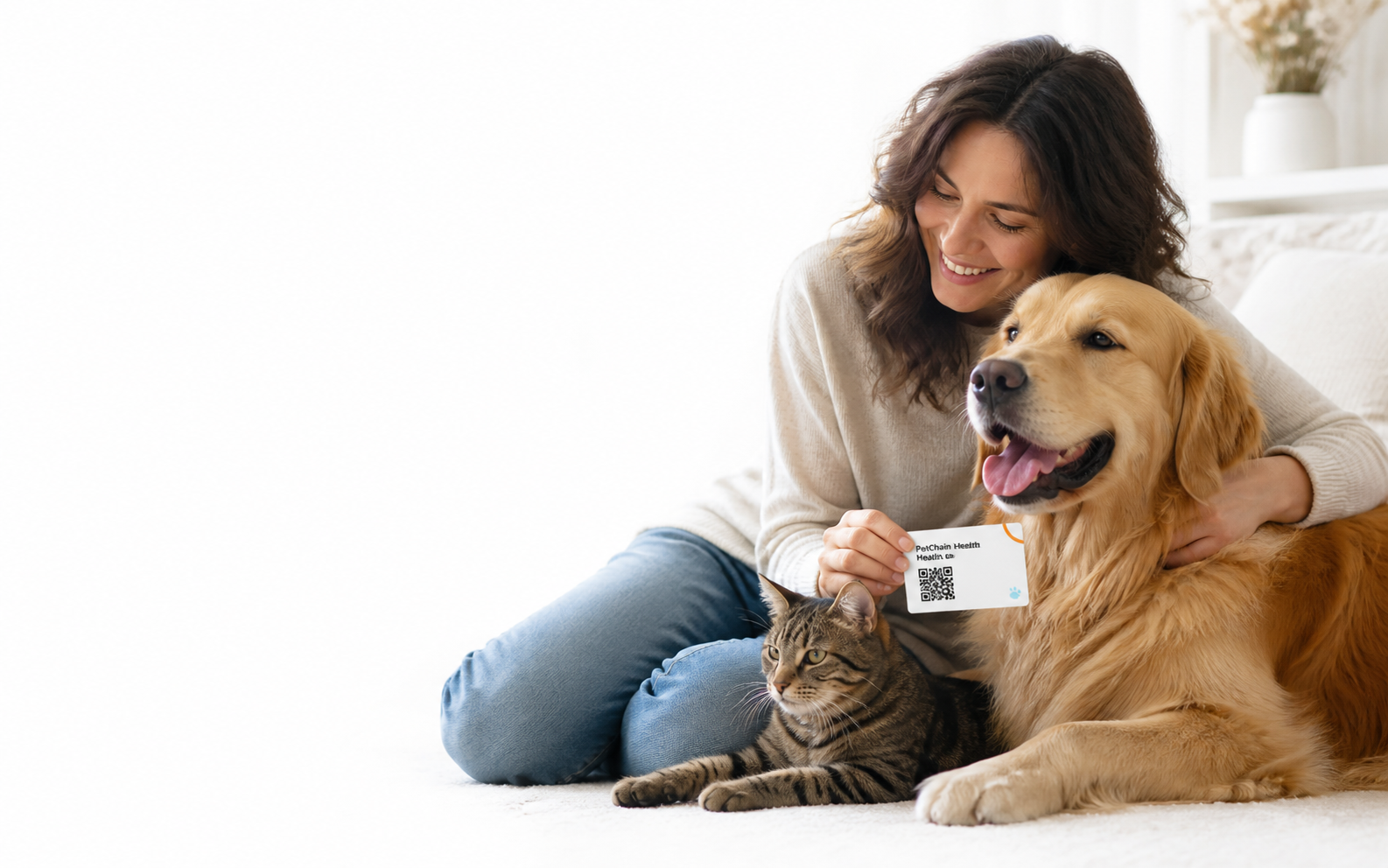 A pet owner with her dog, cat and PetChain Health Card